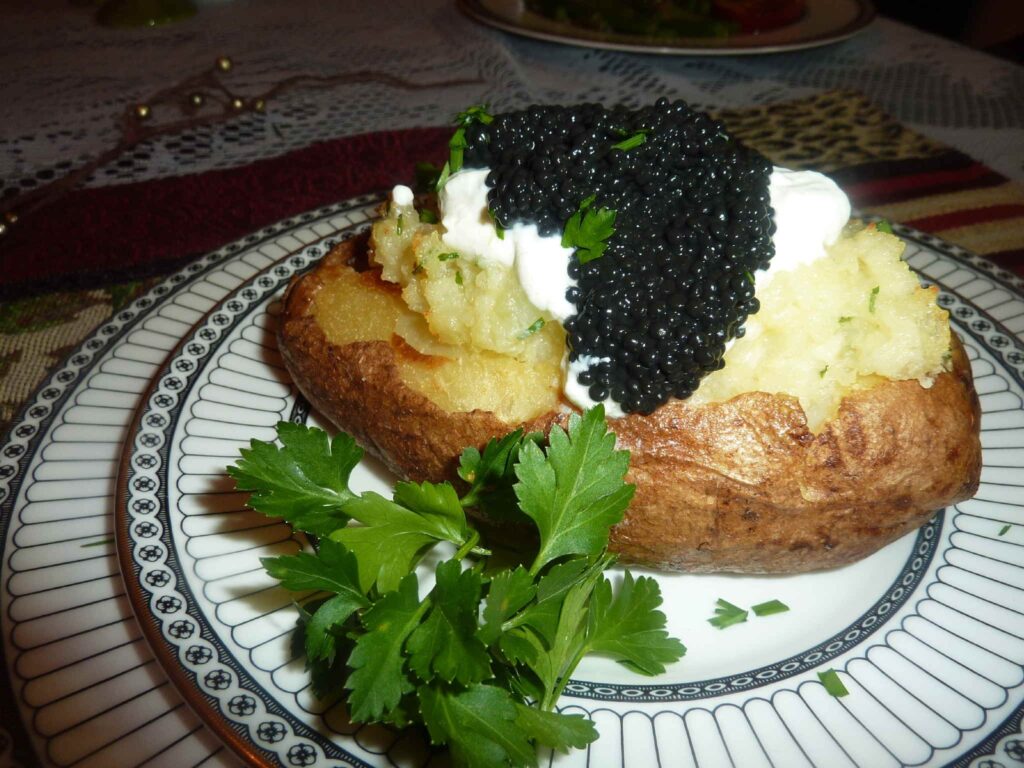 Sour cream, baked potato and caviar